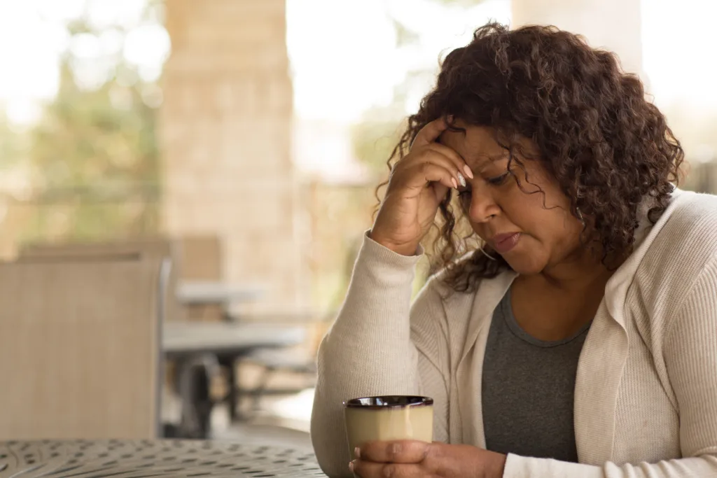 African American middle age woman looking anxious.