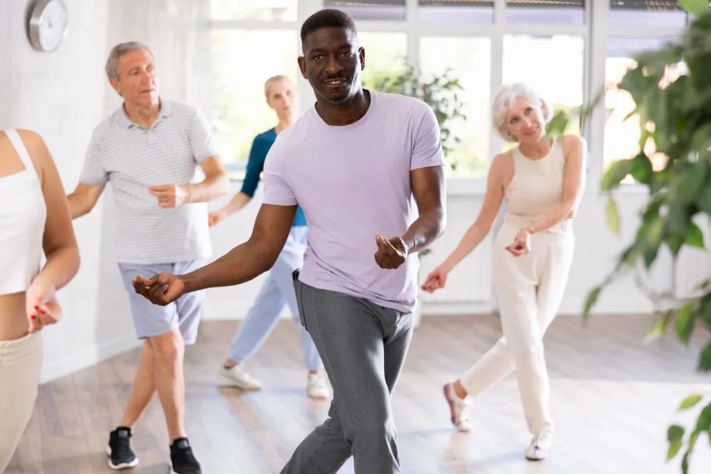 Group of multiethnic mature people dancing modern dance