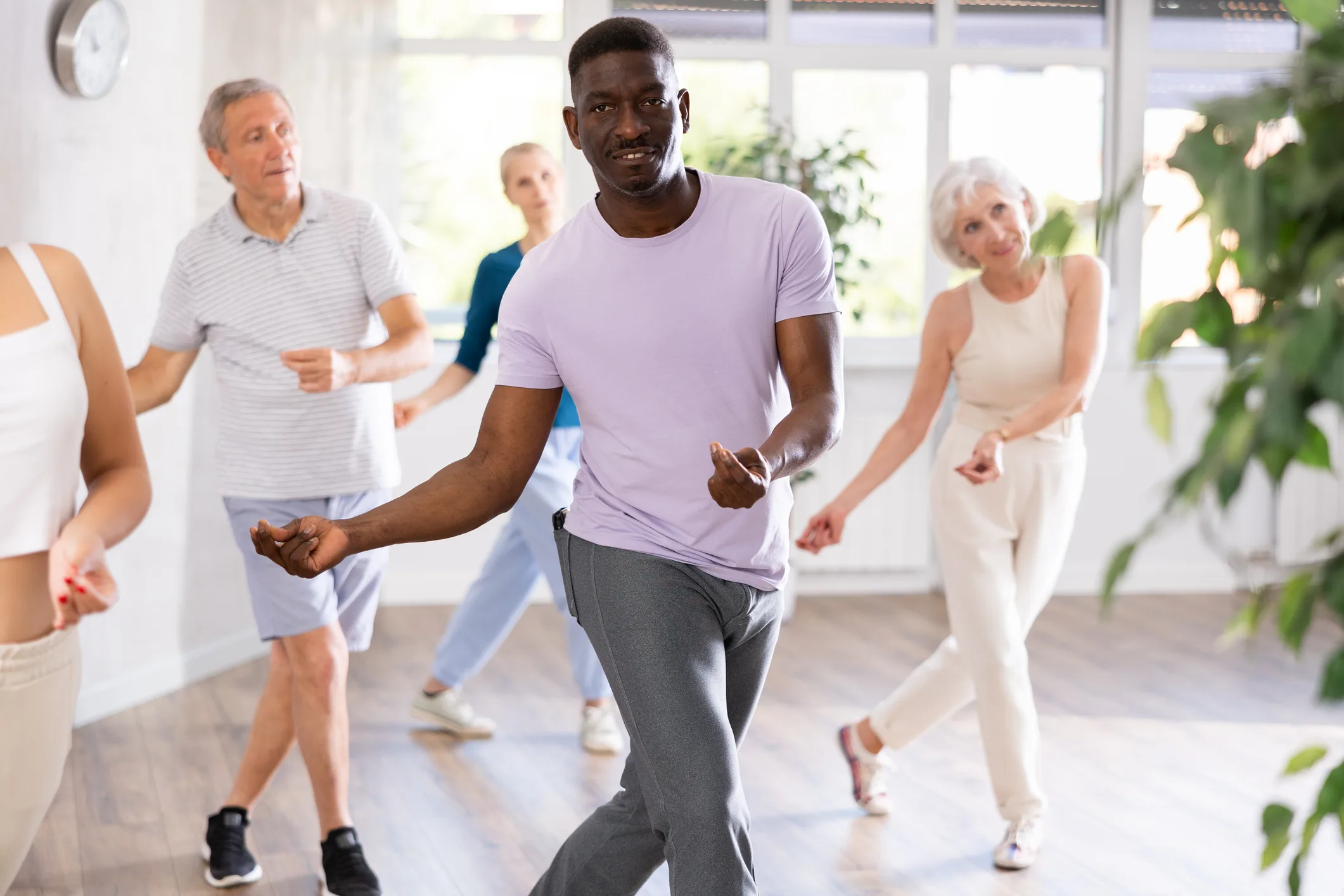 Group of multiethnic mature people dancing modern dance
