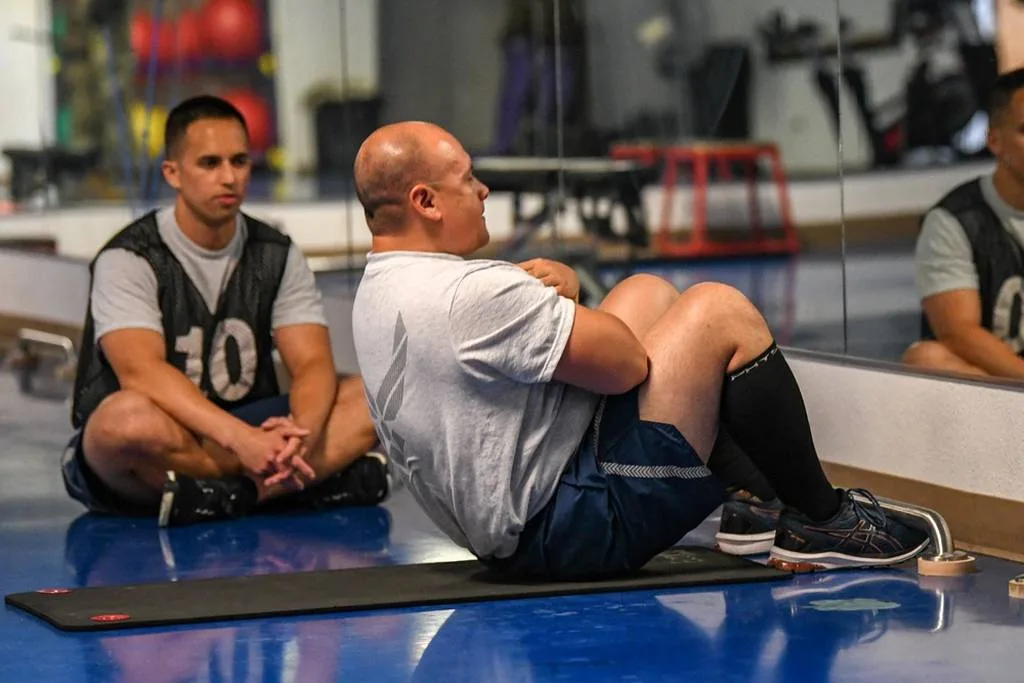 Master Sgt. Nathaniel Vallejo, 320th Missile Squadron manager of intercontinental ballistic missile training, performs as many sit-ups as he can in 60 seconds on July 3, 2021, at F.E. Warren Air Force Base, Wyoming.