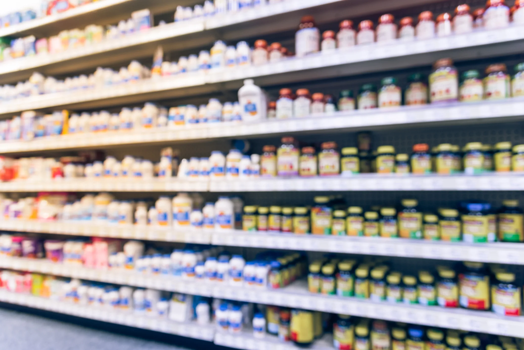 Vintage blurred vitamin store variation of vitamins, supplements