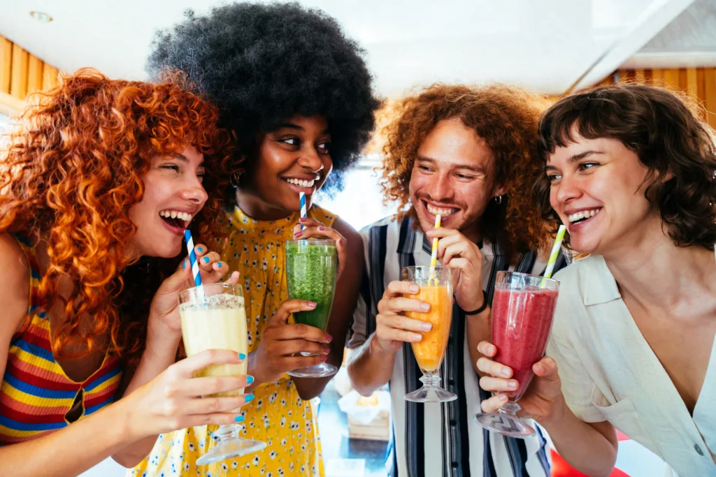 Multiethnic group of friends having meal at diner restaurant