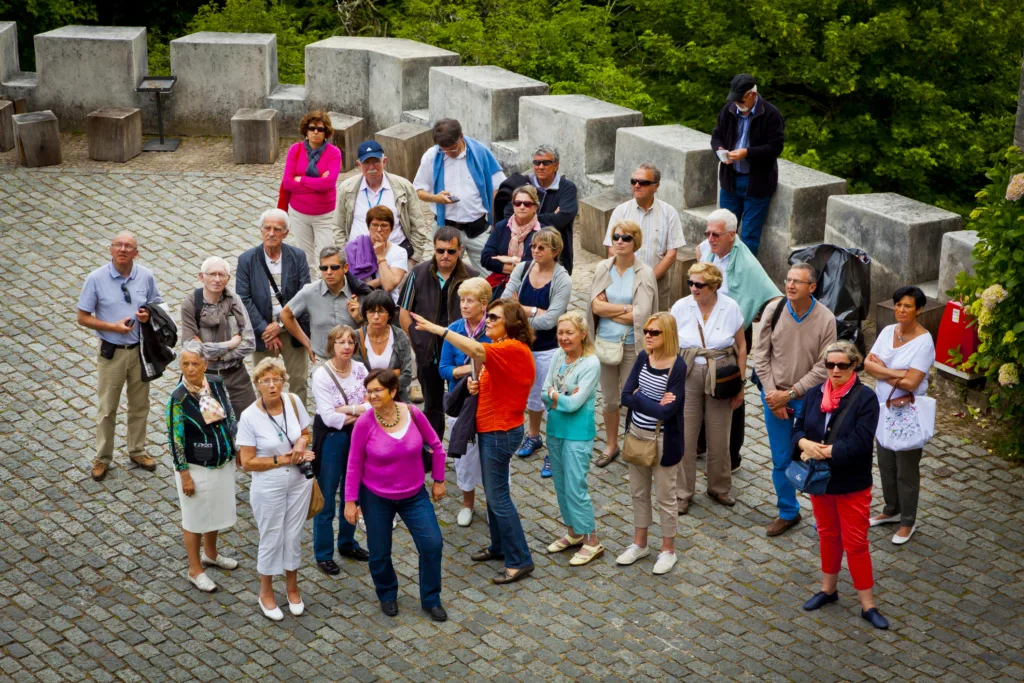 Group of tourists listening to the guide
