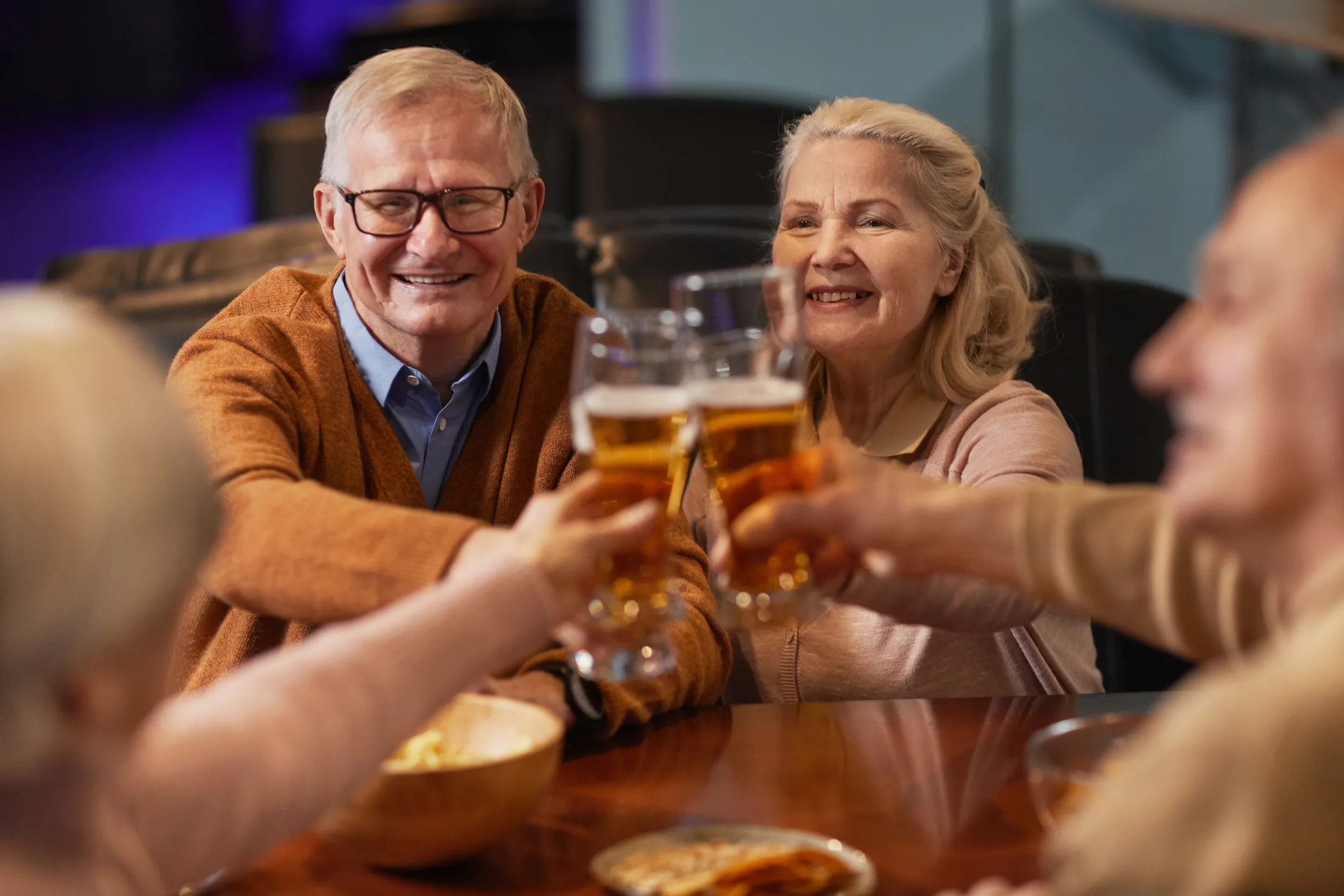Senior People Enjoying Beer in Bar