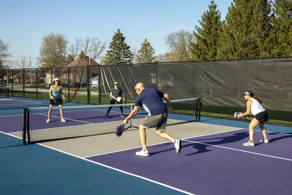 Male Pickleball Player Returning a Volley