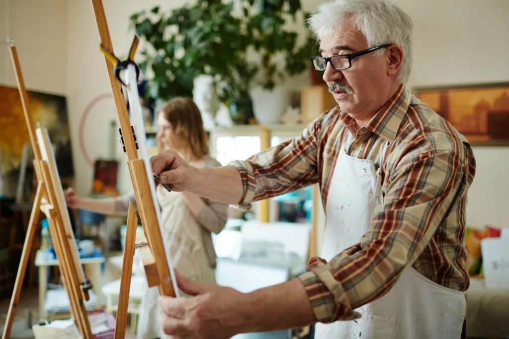 Older man in painting class