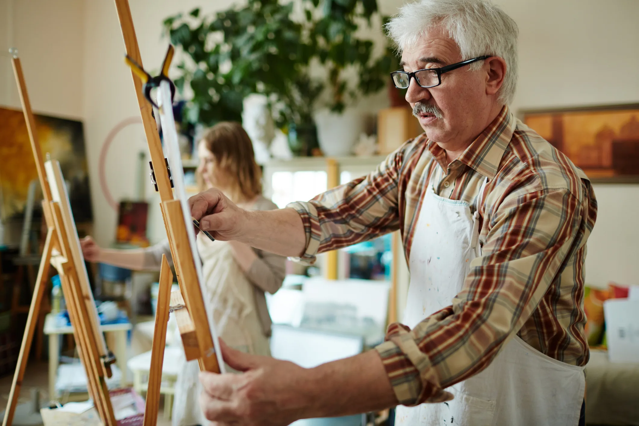 Older man in painting class
