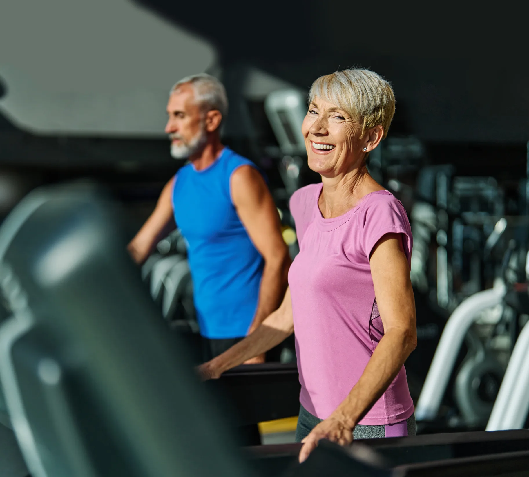 gym woman sport treadmill mature couple exercise active running exercising fitness female senior indoor training healthy vitality