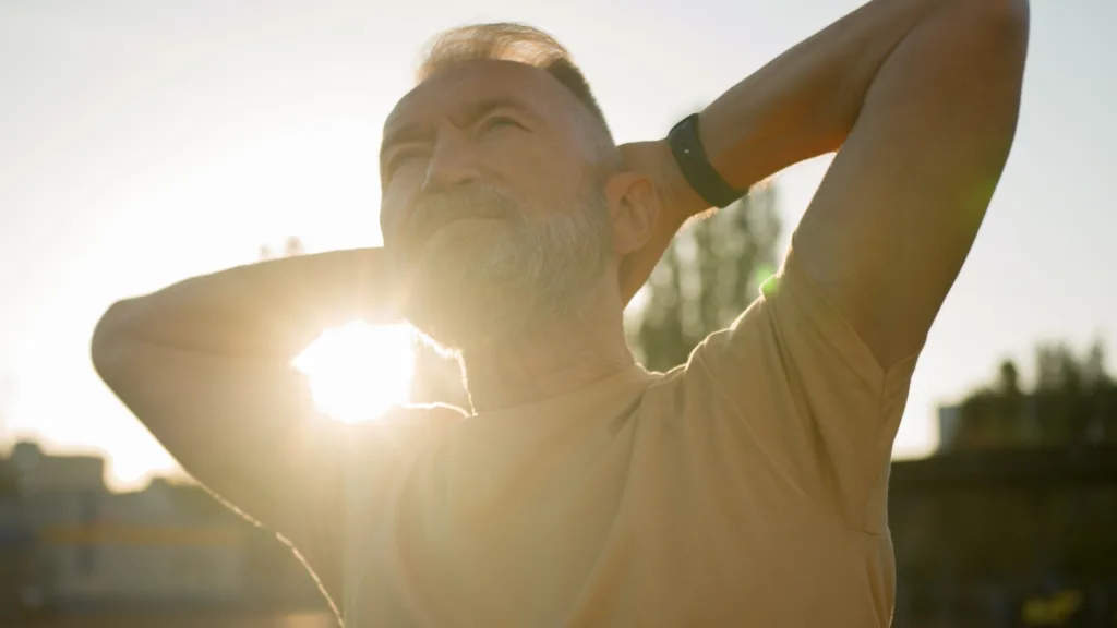 Close up aged Caucasian man old sportsman morning training warm-up sporty lifestyle exercise retired senior stadium city outside masculinity power movement routine aerobics gymnastic bodycare wellness