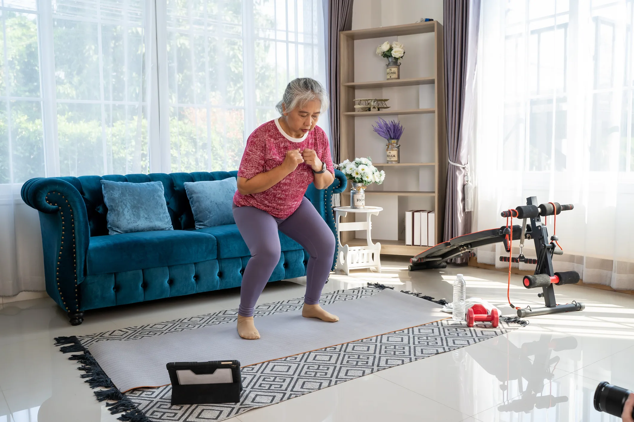 enior woman workout for her knees with squat at home