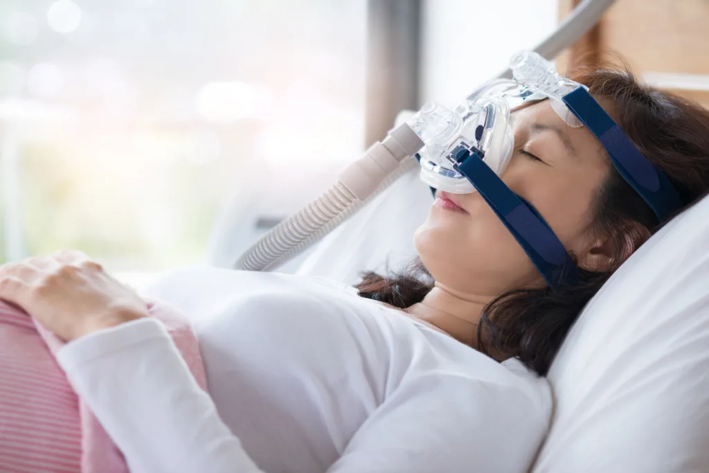 Woman and cpap mask, healthcare concept.